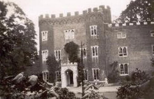 a black and white photo of the front of Hertford Castle which doesn't yet have the north wing