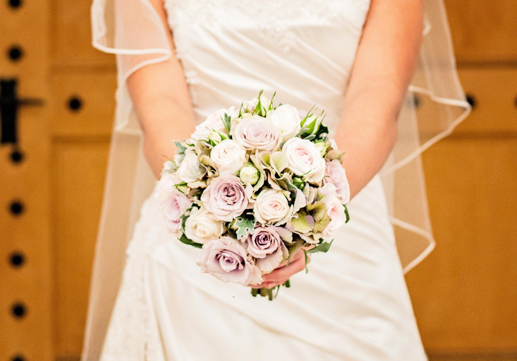 A close up of a bouquet of dusky pink and white flowers
