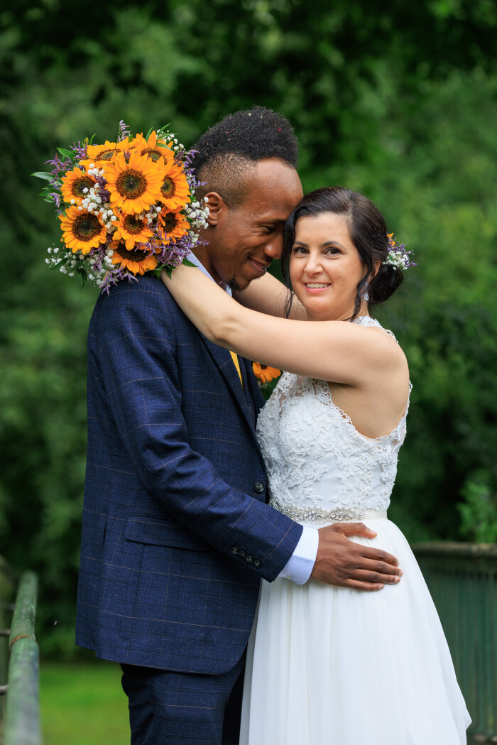 A couple celebrating wedding, groom looking lovingly at Bride